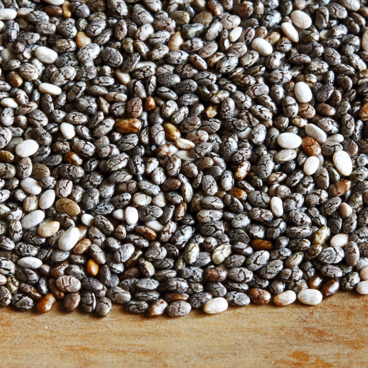 chia-seeds-on-a-wooden-surface-resized.jpg